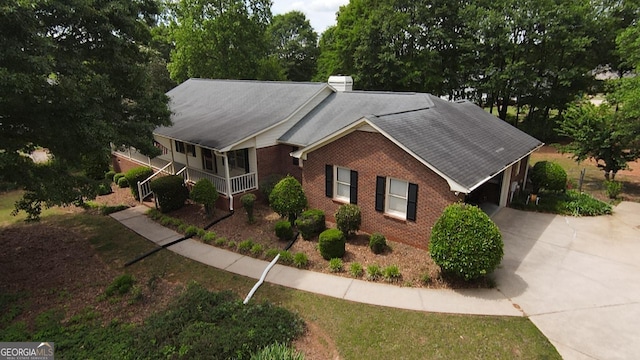 114 Tracy Ln, Mcdonough, GA 30253 - view of front facade featuring driveway, brick siding, and a shingled roof