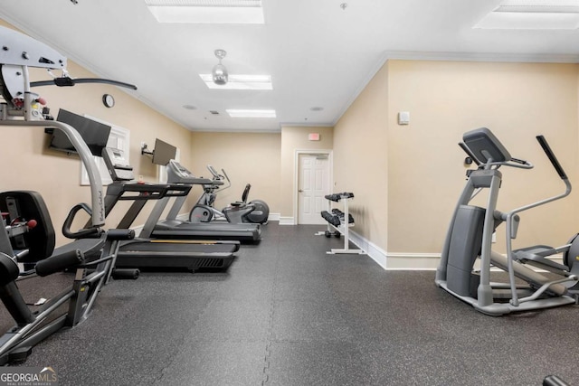 workout area featuring ornamental molding