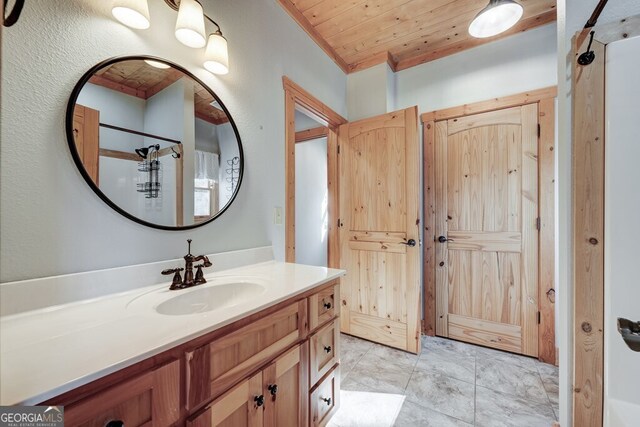 bathroom with wooden ceiling and vanity