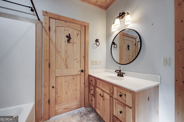 bathroom featuring vanity and a tub to relax in