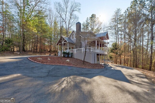 view of side of home featuring a porch