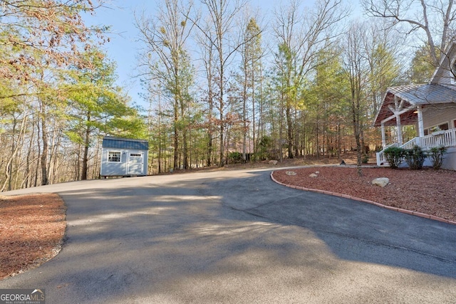 exterior space featuring a storage shed