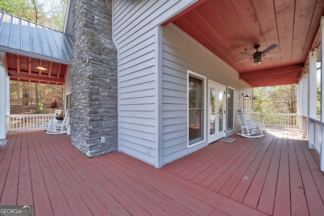 wooden terrace featuring ceiling fan and a porch