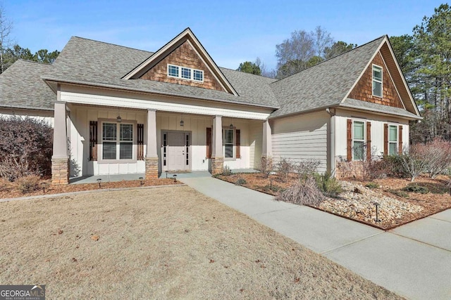 craftsman-style home featuring a porch, roof with shingles, and board and batten siding