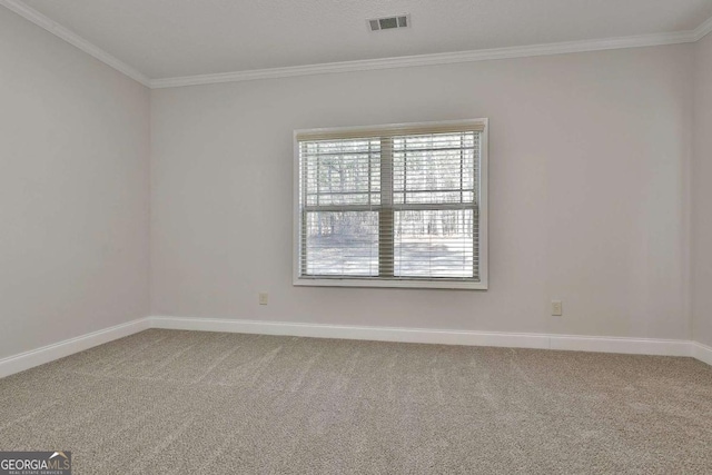 carpeted spare room with crown molding