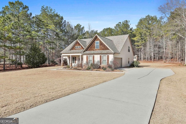 craftsman house featuring a front yard and a porch