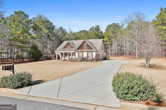 view of front of property with driveway and a porch