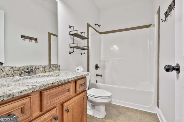 full bathroom with toilet, vanity, tile patterned floors, and bathing tub / shower combination