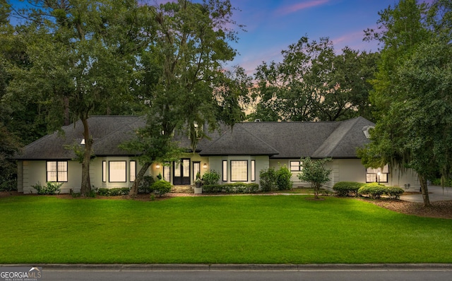 view of front of home with a yard