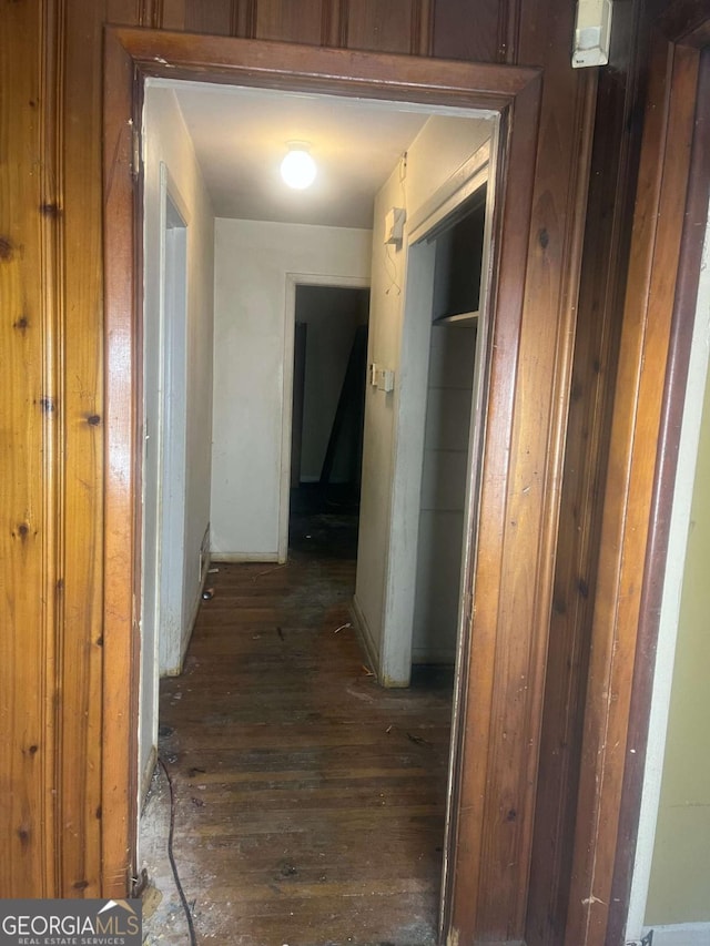 corridor featuring dark wood-type flooring