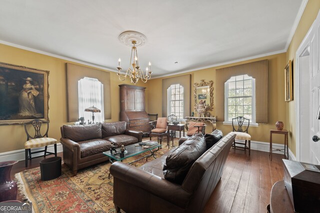 living room with ornamental molding, a notable chandelier, and dark hardwood / wood-style floors