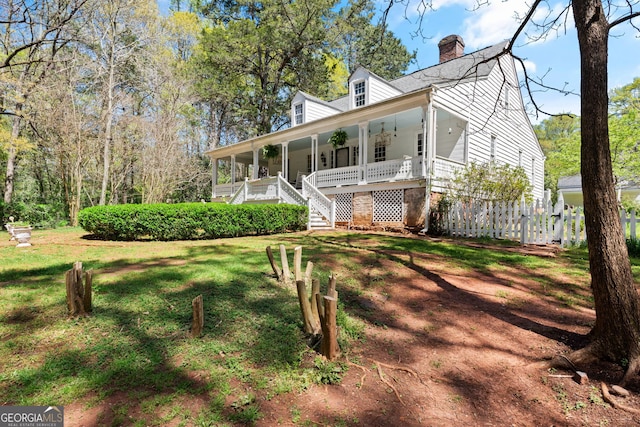 view of front facade with a porch and a front lawn