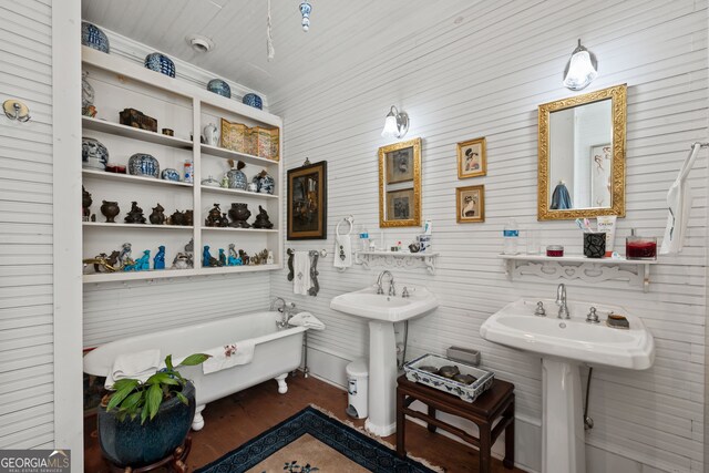 bathroom featuring hardwood / wood-style floors and a bathing tub