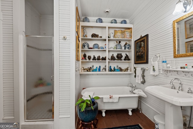 bathroom with wood-type flooring, independent shower and bath, and sink