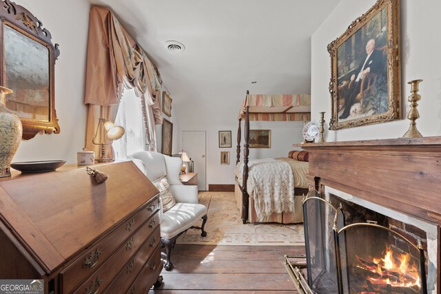 bedroom featuring wood-type flooring