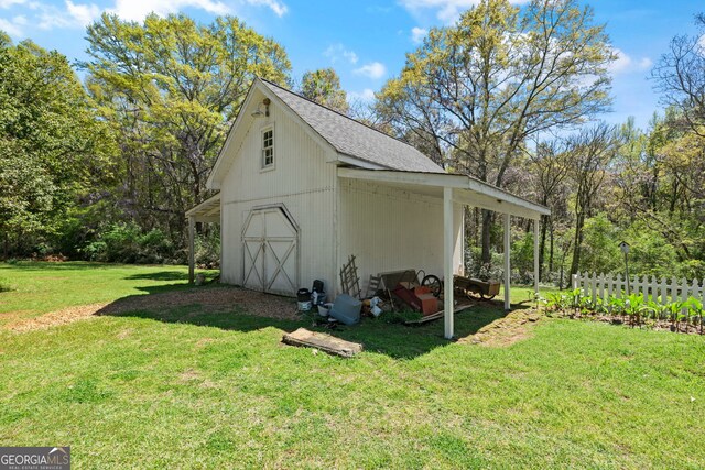 view of outdoor structure with a lawn