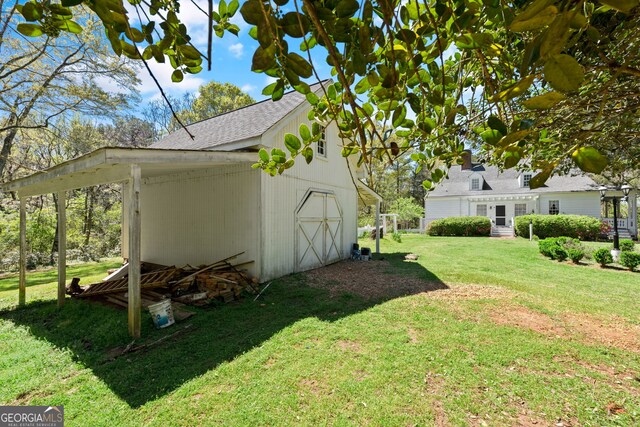 view of side of home featuring a lawn