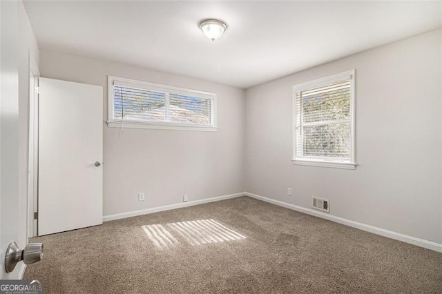 view of carpeted spare room