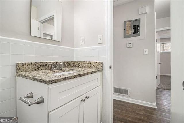 bathroom featuring hardwood / wood-style floors and vanity