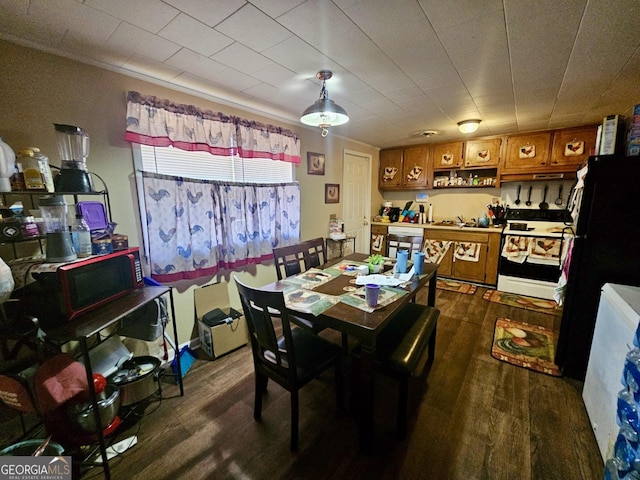 dining space with dark wood-type flooring