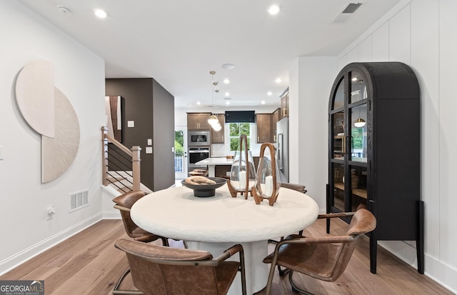 dining room with light wood-type flooring