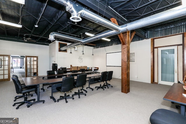 carpeted office space featuring french doors