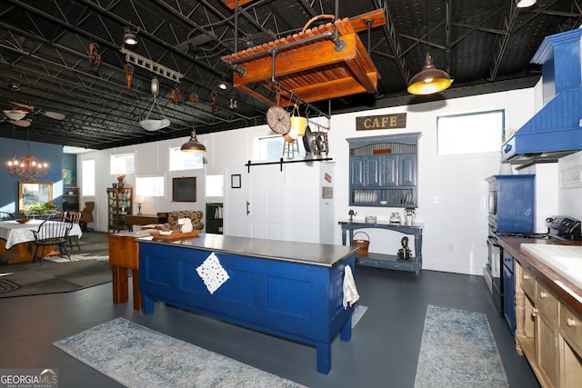 kitchen featuring decorative light fixtures, black / electric stove, custom exhaust hood, and a chandelier