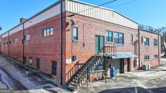 view of building exterior with central air condition unit