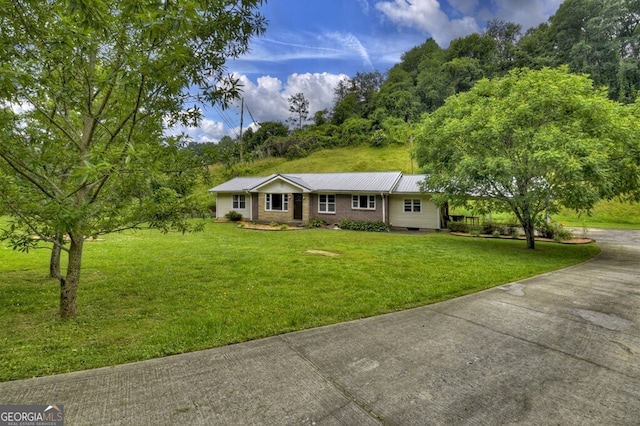 ranch-style house with a front lawn