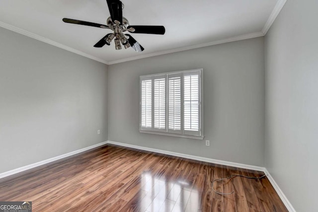 empty room featuring ceiling fan, ornamental molding, and hardwood / wood-style flooring