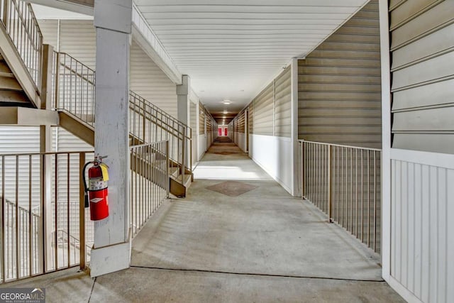 hallway with concrete floors