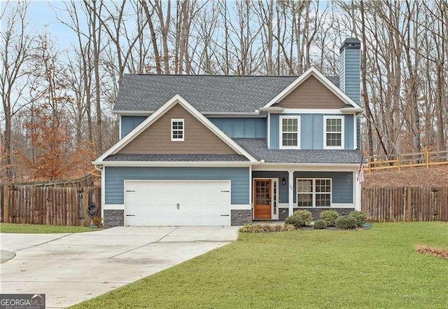 craftsman-style home featuring a front yard and a garage