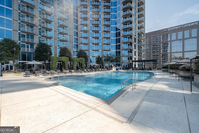 view of swimming pool featuring a patio area