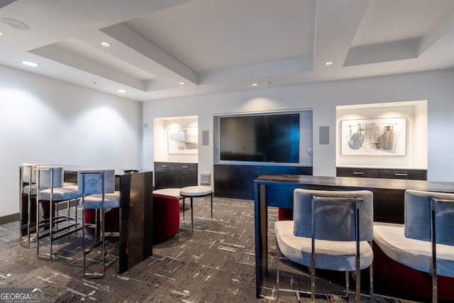 living room featuring a tray ceiling