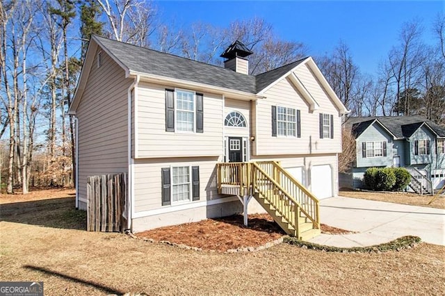 split foyer home featuring a garage