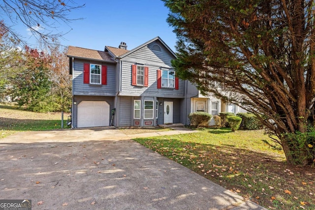 front facade featuring a front yard and a garage