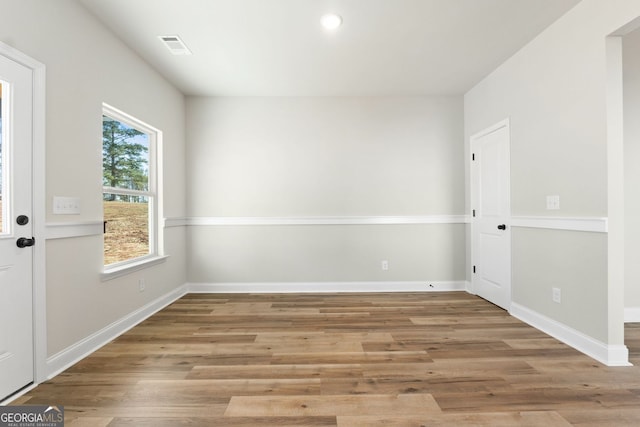 spare room featuring light hardwood / wood-style flooring