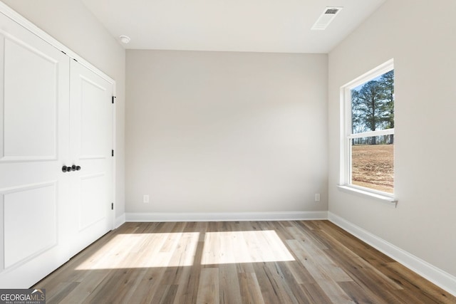 unfurnished bedroom featuring light wood-type flooring