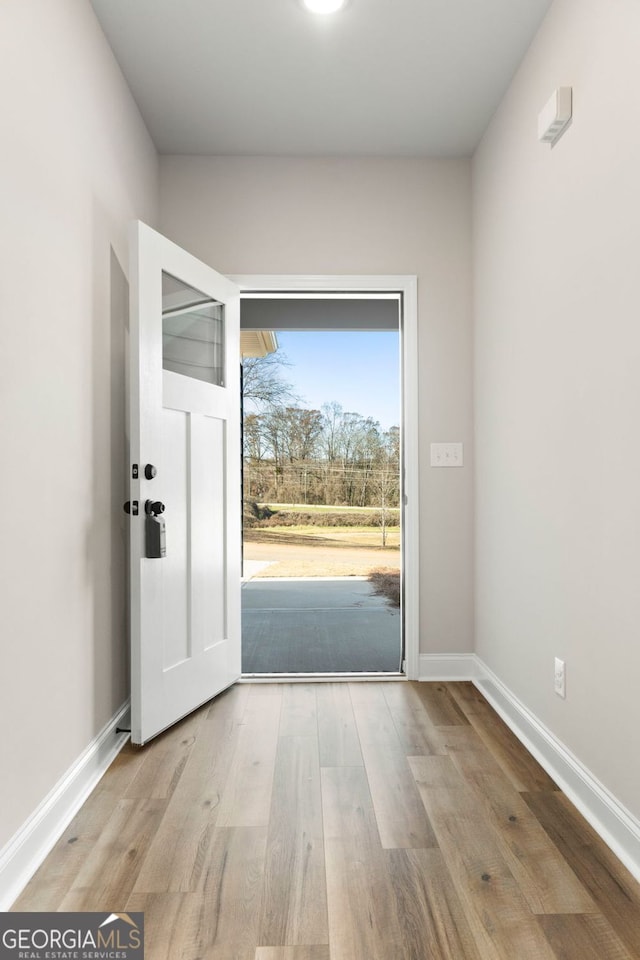 entryway with light hardwood / wood-style floors