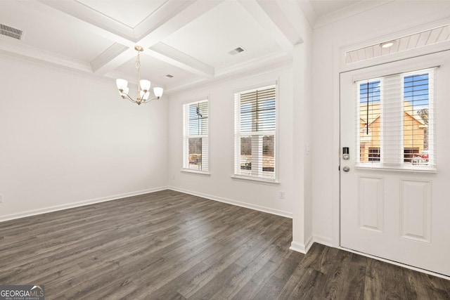 entryway with beamed ceiling, coffered ceiling, crown molding, dark wood-type flooring, and an inviting chandelier