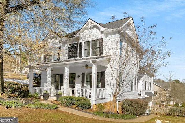 view of front of house with ceiling fan and a porch