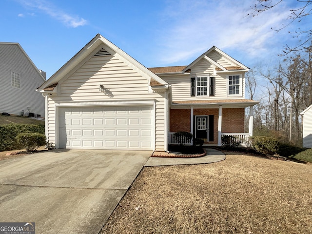 front of property with a porch and a garage