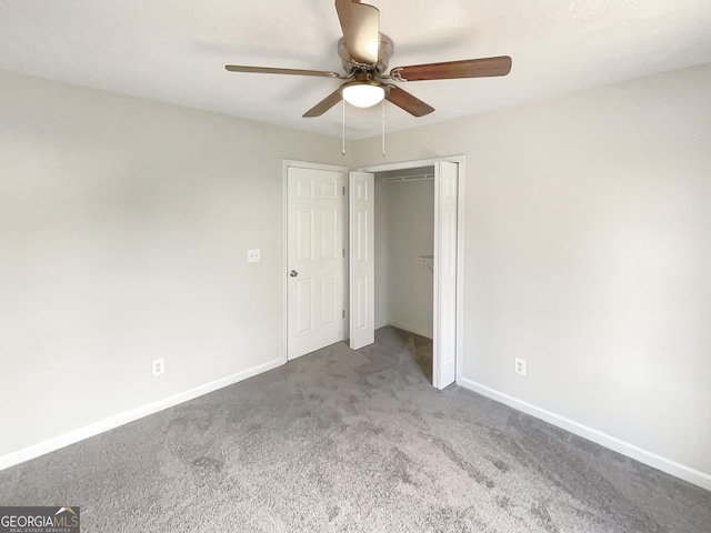 unfurnished bedroom featuring a closet, carpet floors, and ceiling fan