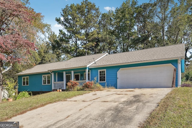 single story home with a front yard, a garage, and covered porch