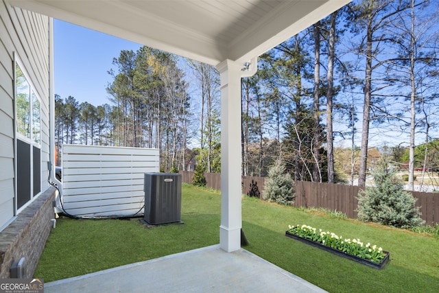 view of yard with a patio and central AC