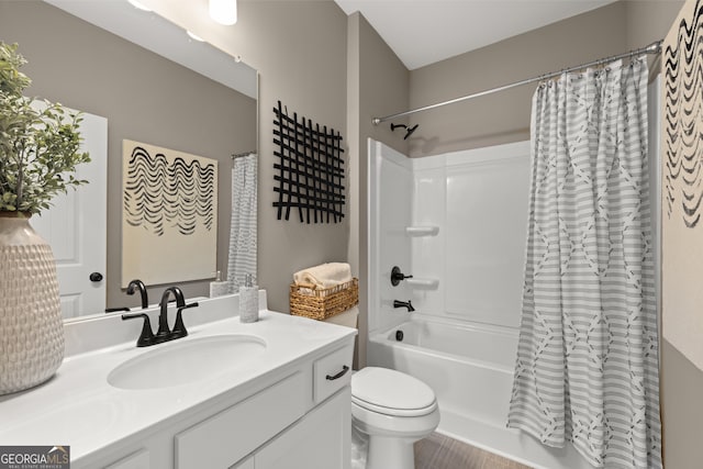 full bathroom featuring toilet, vanity, and shower / bathtub combination with curtain