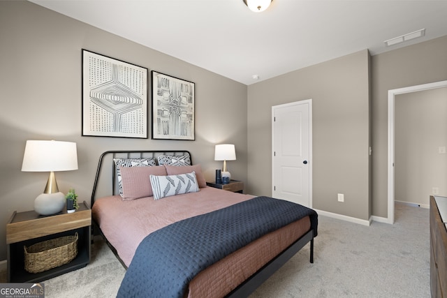 bedroom featuring light colored carpet