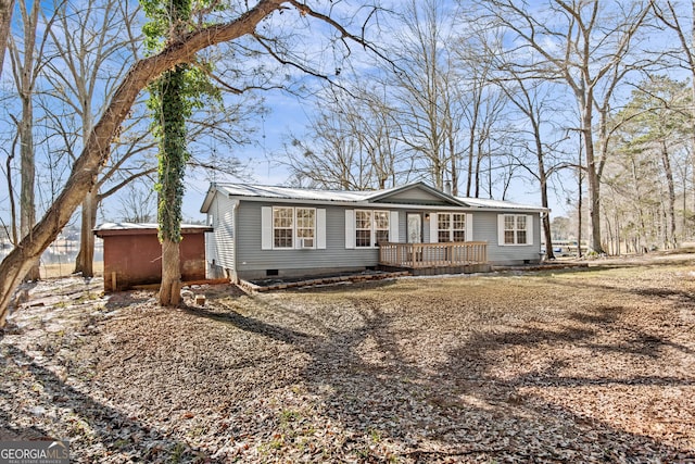 ranch-style house with a deck