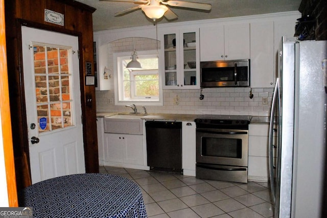 kitchen featuring white cabinetry, tasteful backsplash, and appliances with stainless steel finishes