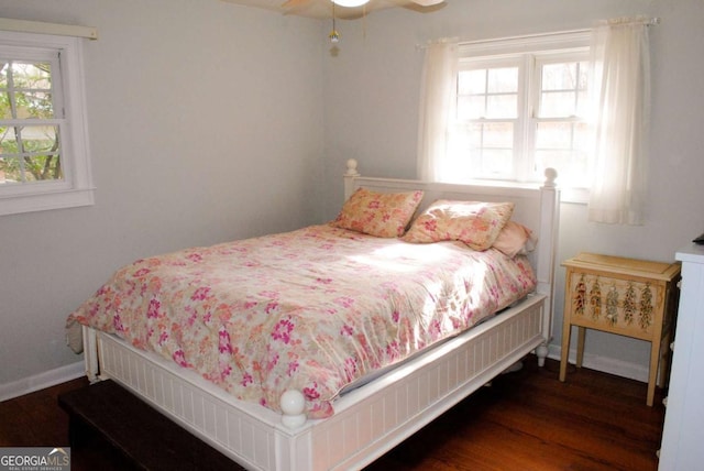 bedroom featuring ceiling fan and dark hardwood / wood-style flooring